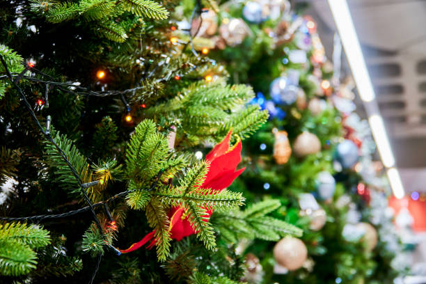 istock Sparkling Christmas trees at the supermarket 1668363394