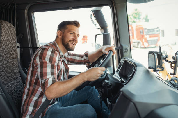 istock Man Trucker Driving His Truck 1668409026