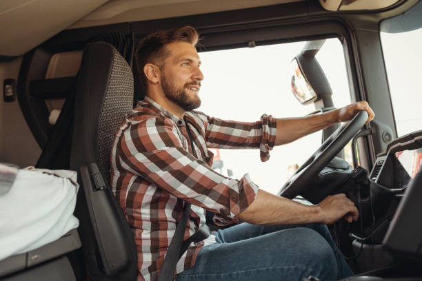 istock Man Trucker Driving His Truck 1668409534