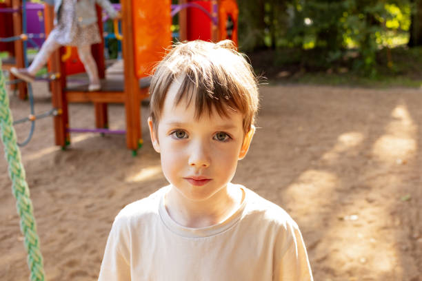 istock 6 year old boy playing on the playground 1668438378