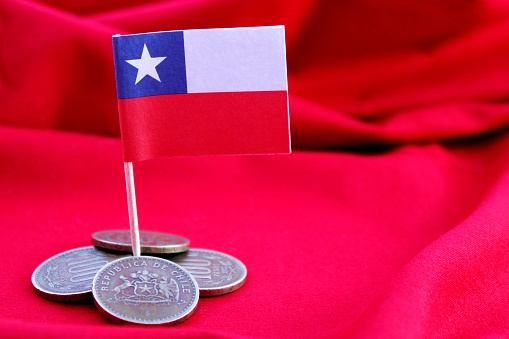 Chilean flag and hundred coin with shield