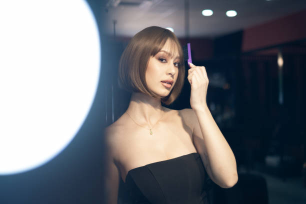 istock Young Woman Looking Into Makeup Mirror At Herself 1668524615