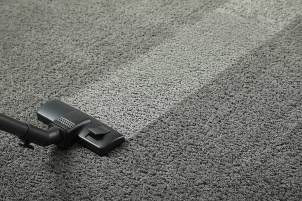 istock Hoovering carpet with vacuum cleaner, space for text. Clean trace on dirty surface 1668552652