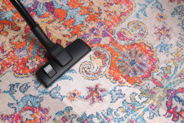 istock Hoovering carpet with vacuum cleaner, above view and space for text. Clean trace on dirty surface 1668552669