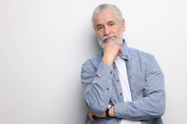 istock Portrait of handsome senior man on white background. Space for text 1668574525