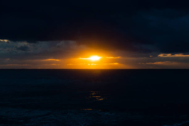 istock Sunrise in the ocean 1668575937