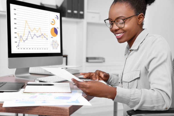 istock Professional accountant working at wooden desk in office 1668608556