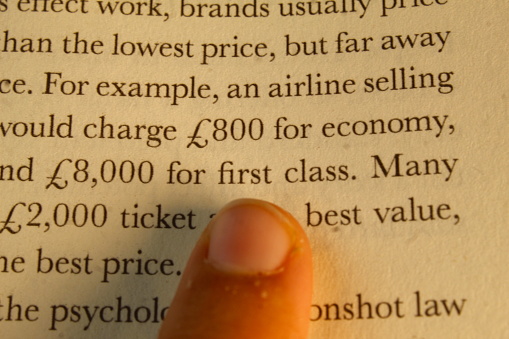A photo of a the words on the pages of a book about business.