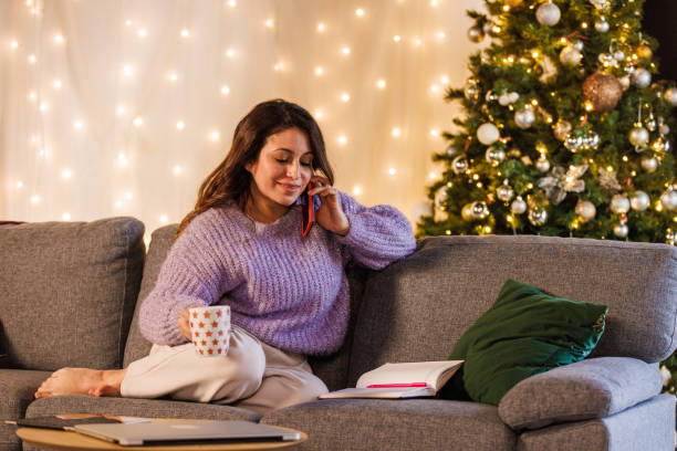 istock Woman being interrupted by a phone call while writing in a diary 1668720504