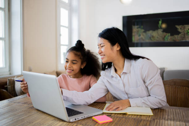 istock Little girl is learning at home with her teacher 1668724067