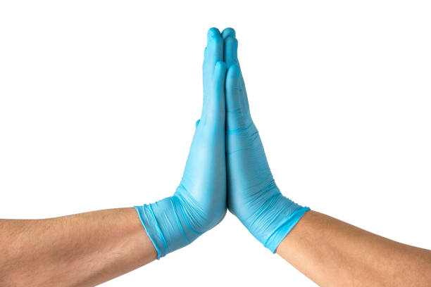 Two medical workers making a high five gesture , isolated on white background