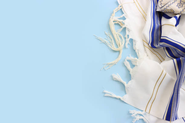 religion image of white prayer talit. Rosh hashanah (jewish New Year holiday), Shabbat and Yom kippur concept religion image of white prayer talit. Rosh hashanah (jewish New Year holiday), Shabbat and Yom kippur concept jewish prayer shawl stock pictures, royalty-free photos & images