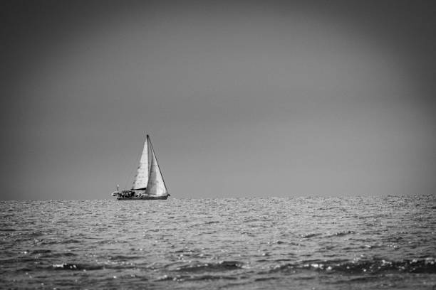 istock Solitary boat in the horizon 1668892692