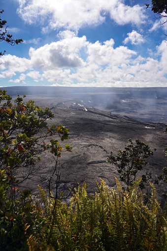 Hawaii Volcanoes National Park is on Hawaii Island (the Big Island). Kīlauea, pictured here, is the youngest and most active volcano on the island, with a consistently active summit caldera that frequently hosts lava lake-style eruptions.