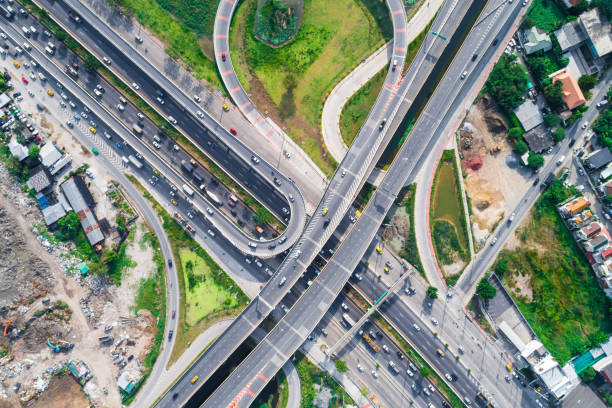 istock Above transport intersection rural road with car green tree 1669023935