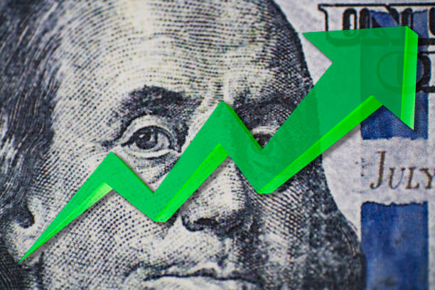 istock 100 USC Bill superimposed with green upward arrow indicating growth. 1669039335