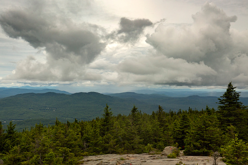 Rainshower in the foothills of the White Mountains, seen from the summit of Mt. Kearsarge at Winslow State Park in Wilmot, New Hampshire.