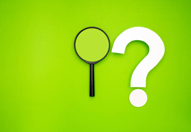 istock A magnifying glass and a white question mark symbol are on a light green background 1669073207