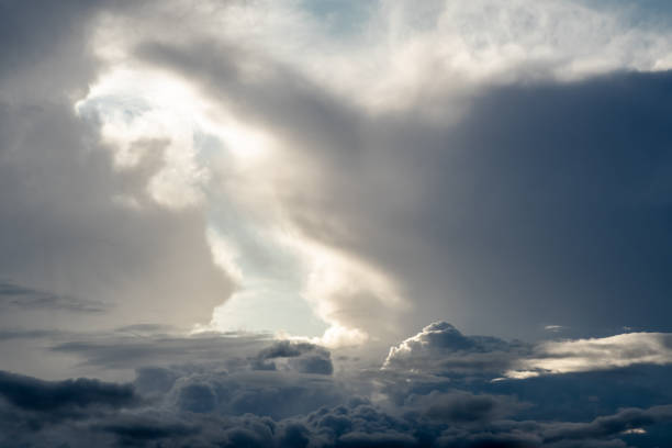 Dramatic sky with grey clouds over the city before the storm. Weather before or after a storm.