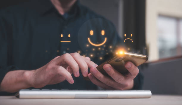 istock Customer service satisfaction survey concept.Business people or customers show satisfaction by pressing face emoticon smile in satisfaction on virtual touch screen. rating very impressed 1669083567