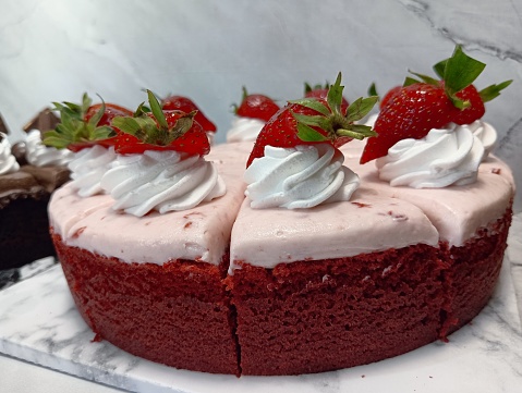 cake with cream and fresh strawberries.