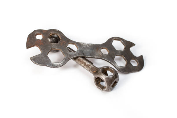 dumbbell spanner and vintage  dogbone wrenches for hexagonal head cap  Bike screws, soft focus close up, isolated on white