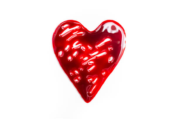 istock Heart shape made with red blood isolated on white background, close up 1669112261