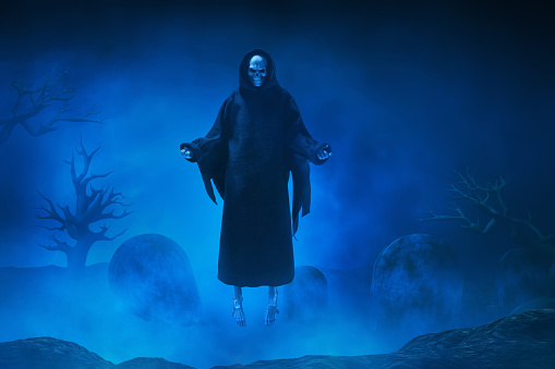 Flying grim reaper on graveyard cemetery with blue fog or smoke background