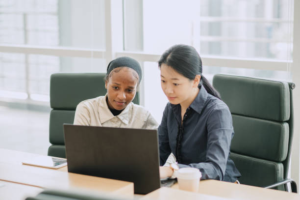 istock Two multiracial businesswomen talking in office. 1669123522