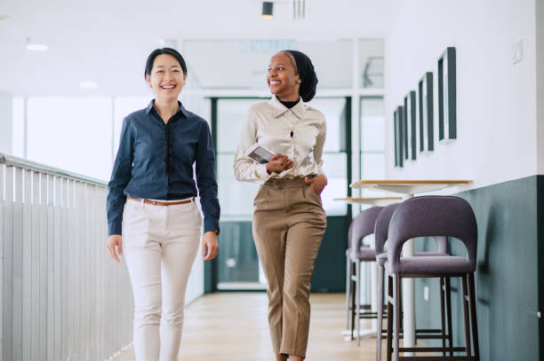 istock Two multiracial businesswomen talking in office. 1669124071