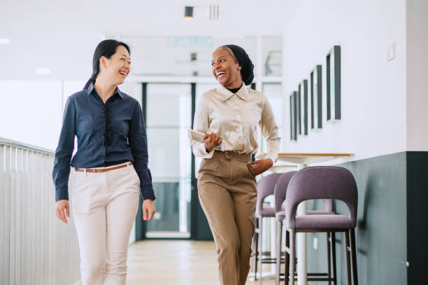 istock Two multiracial businesswomen talking in office. 1669124389