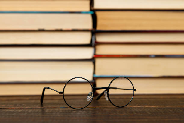 istock Glasses and books on the table. Concept teacher's day, study, reading, literature, development. 1669134797