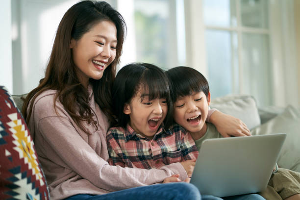 istock young asian mother and two children using laptop computer together 1669143532