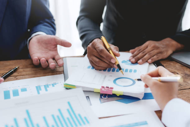 istock Business people meeting explaining the financial graph data and marketing plan. 1669145680