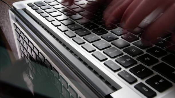 istock Male Hands Typing on Laptop Keyboard Time Lapse 1669211803
