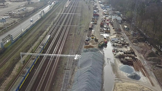 Aerial of Electric Passenger Trains on Multiple Tracks Railway Tracking Shot
