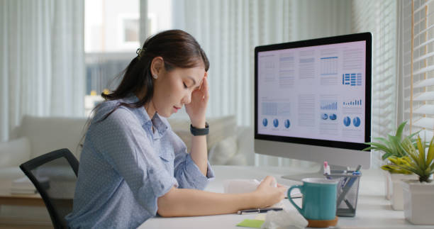 istock Asia people young lady remote workforce work on leave day got bad cold flu covid cough blow running nose on tissue paper sit on desk at home office. Tired unwell female freelance staff stress pain. 1669216634