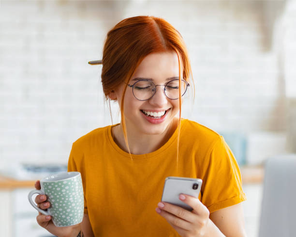 istock Young woman with mobile phone uses apps writes text message communicates online on social media 1669218109