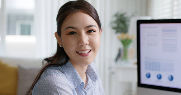 istock Reskill upskill workforce project asia woman people relax smile to camera remote work at home office. Young girl study MBA finance online class learn lesson SEO insight data analyst report training. 1669221419