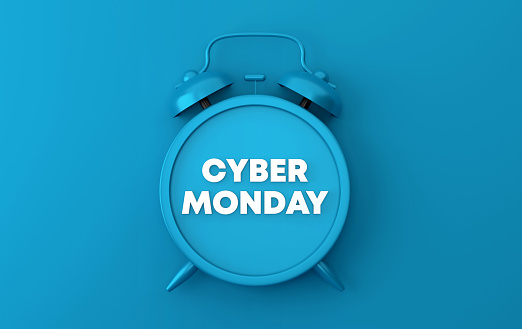 Blue Alarm Clock With Cyber Monday Text On Blue Background. Sale and communication concept.