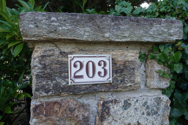 Street number 203 on a retro style plaque