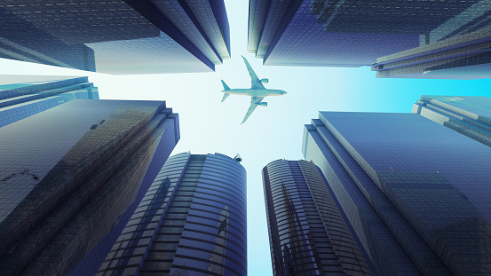 Experience the synergy of modern financial buildings and the grace of a flying aeroplane in this captivating image. Marvel at the urban skyline as sleek skyscrapers stand tall in the backdrop while an airliner soars through the blue skies. This stock image beautifully captures the essence of urban architecture and aviation, making it a versatile addition to your visual projects. Whether you need a cityscape or a representation of air travel, this image provides a dynamic blend of modernity.