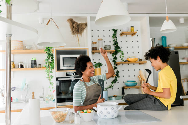 istock Mother and son cooking lunch at kitchen 1669394384