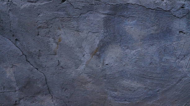 istock Grunge wall texture. Grunge background. Wall fragment with scratches and cracks 1669396937