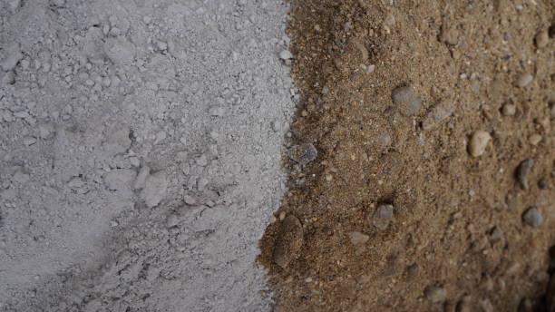 istock Cement powder mixed with sand close up 1669406098