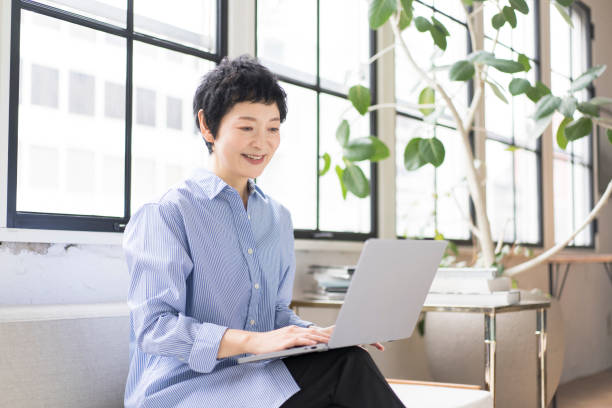 istock An Asian woman is working on a laptop. 1669443332