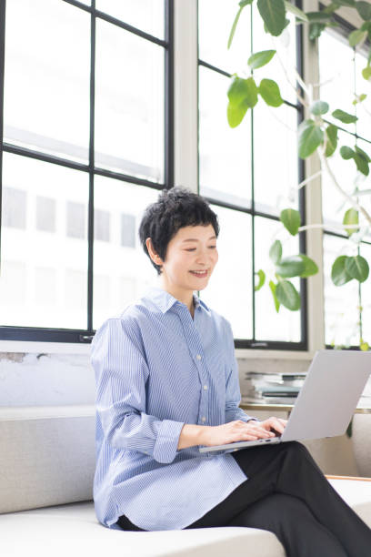 istock An Asian woman is working on a laptop. 1669443333