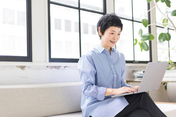 istock An Asian woman is working on a laptop. 1669443676