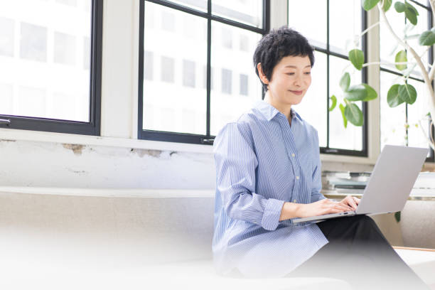 istock An Asian woman is working on a laptop. 1669443738