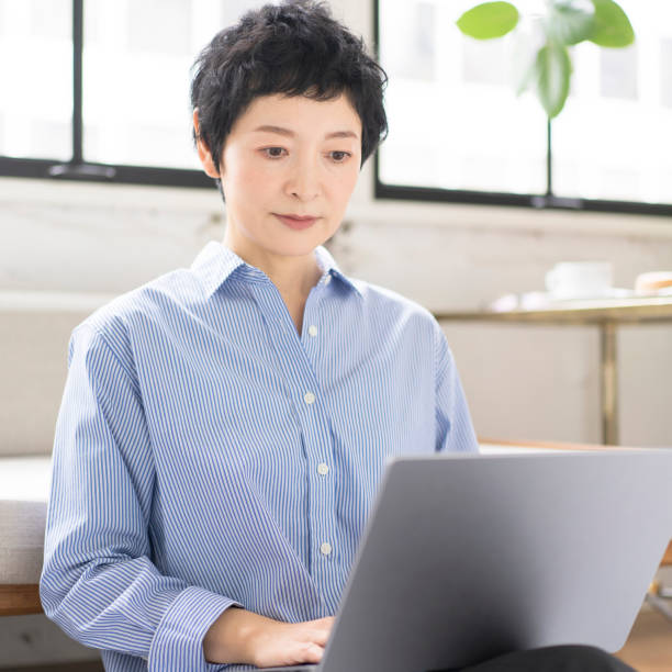 istock A middle-aged woman is working on a laptop. 1669444373